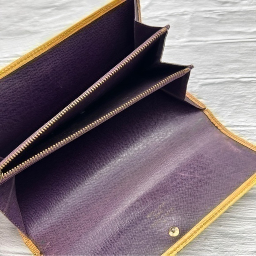 AUTHENTIC Louis Vuitton Epi Porte Tresor International wallet. Tassel yellow. - Picture 3 of 11